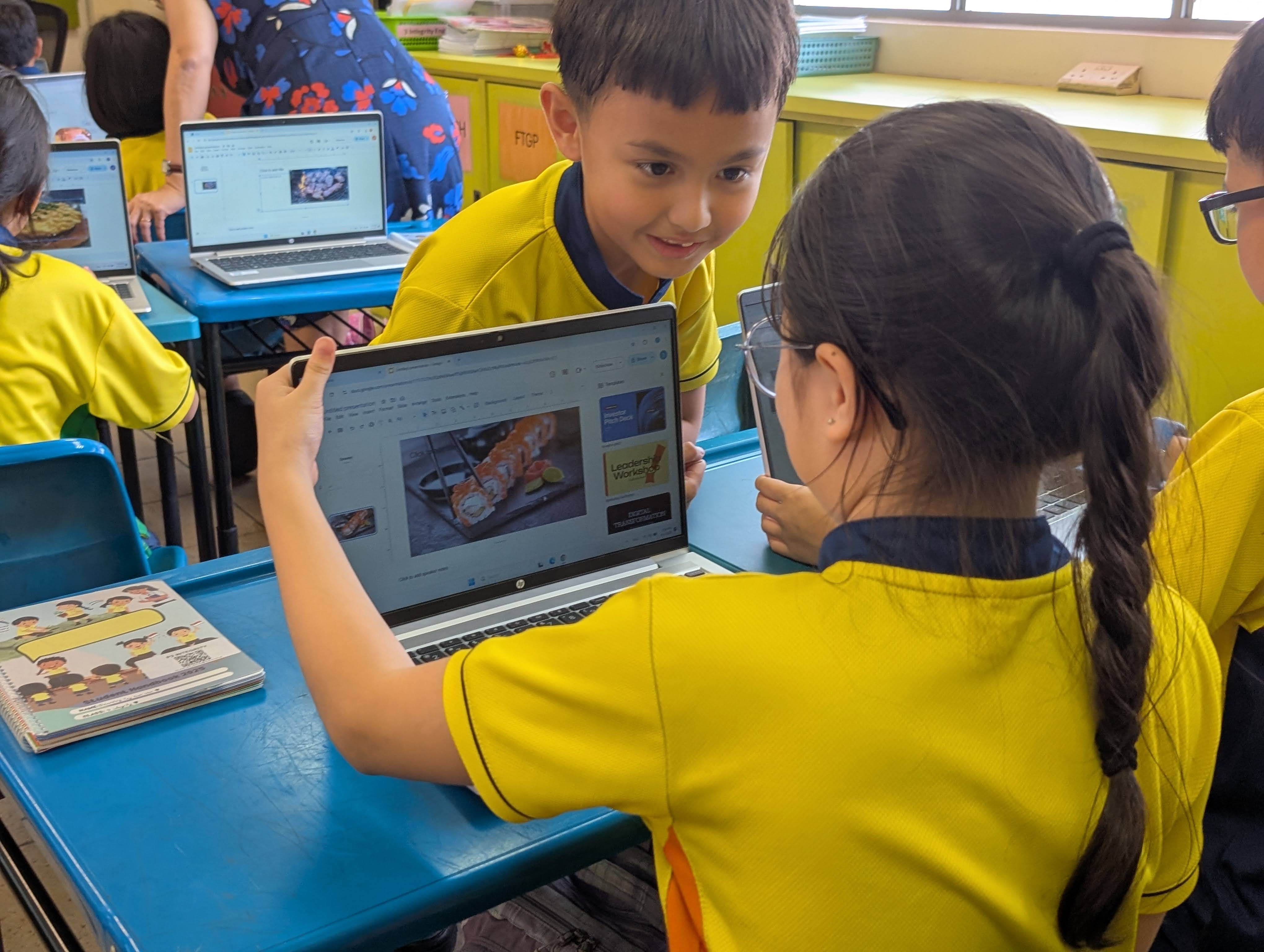 Students in class learn how to use and create with Google Slides